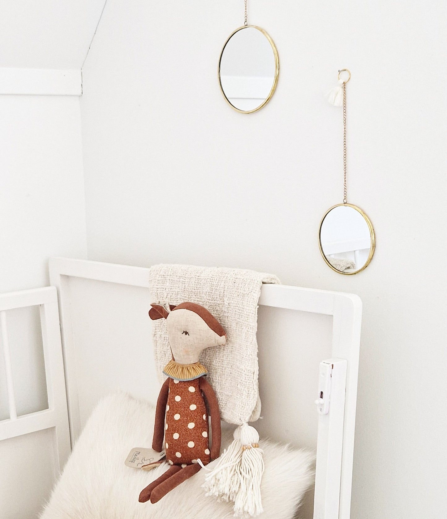 Set of 2 round brass mirrors on chain with tassel