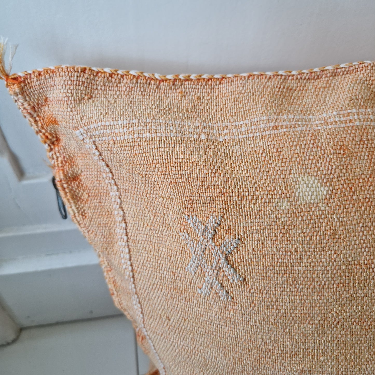 Sabra Silk cushion cover Vintage Orange with light stains on the front