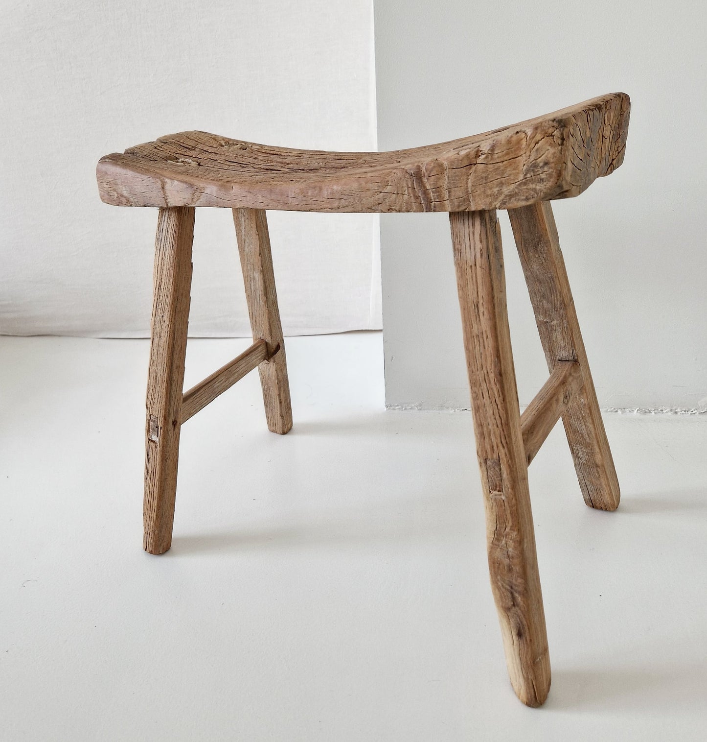 Old wooden saddle stool