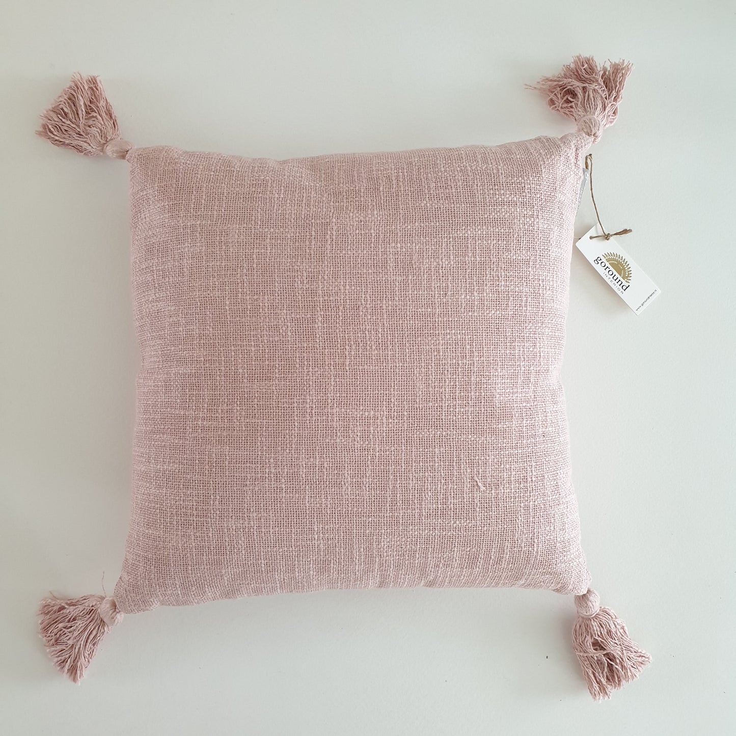 Pink pillow with tassels